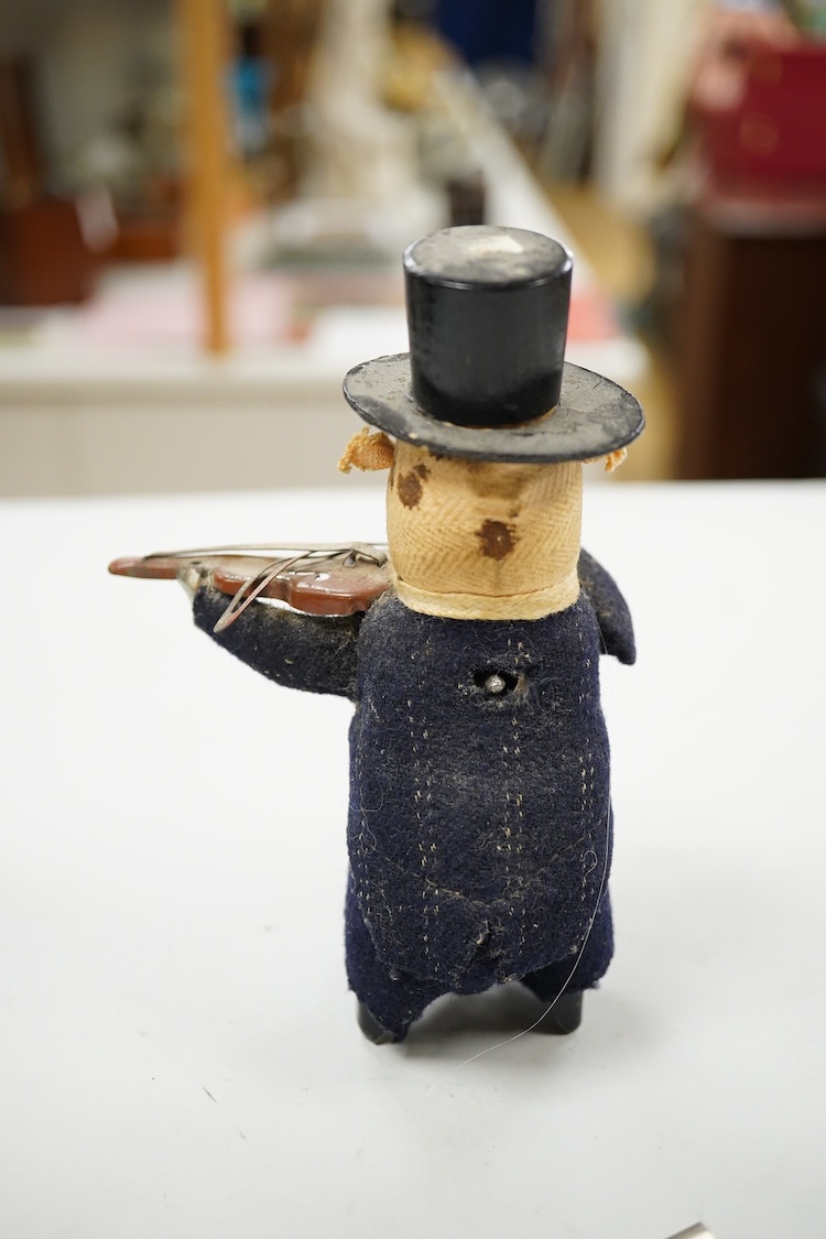 A Schuco felt clockwork pig violinist and key, 13cm high